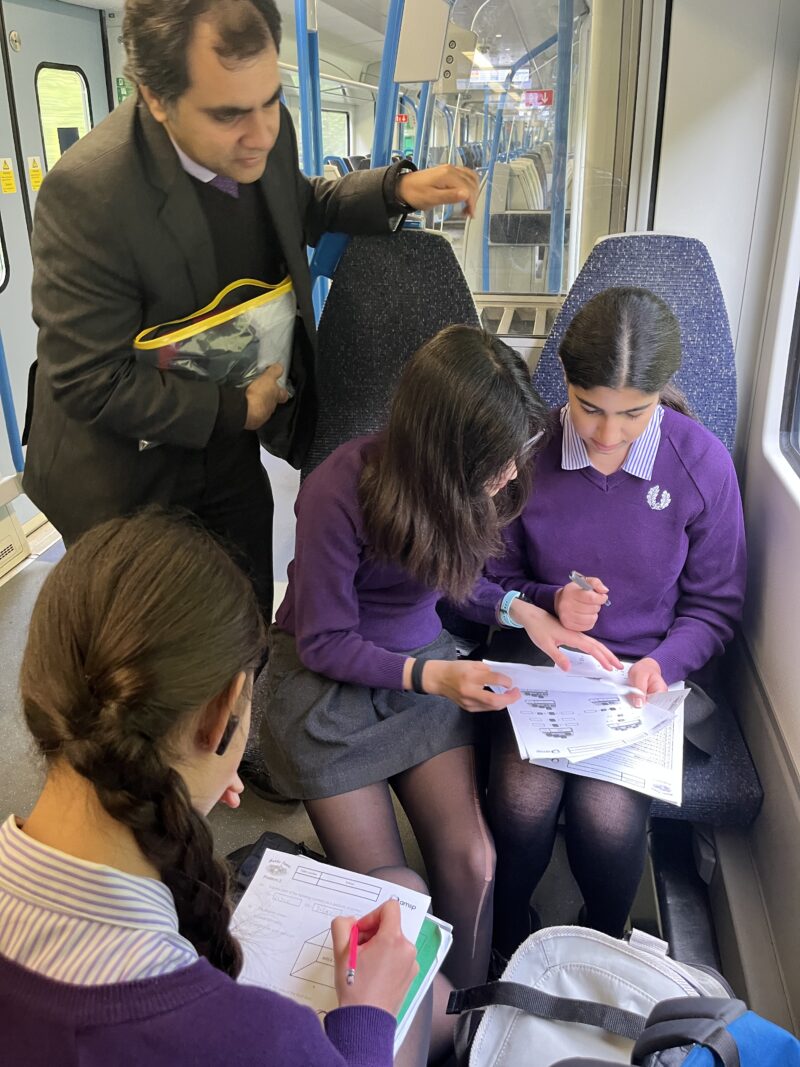 Solving maths problems on the train in preparation for the competition